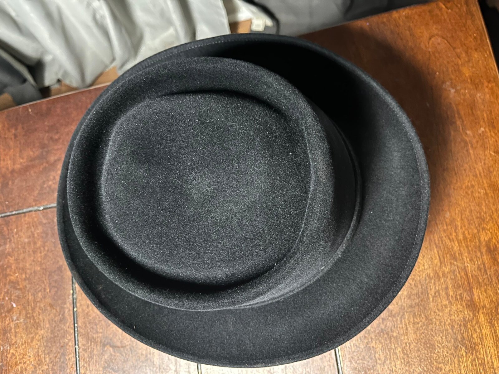 Overhead view of the first pork pie shaping showing the initial telescope crown and brim.