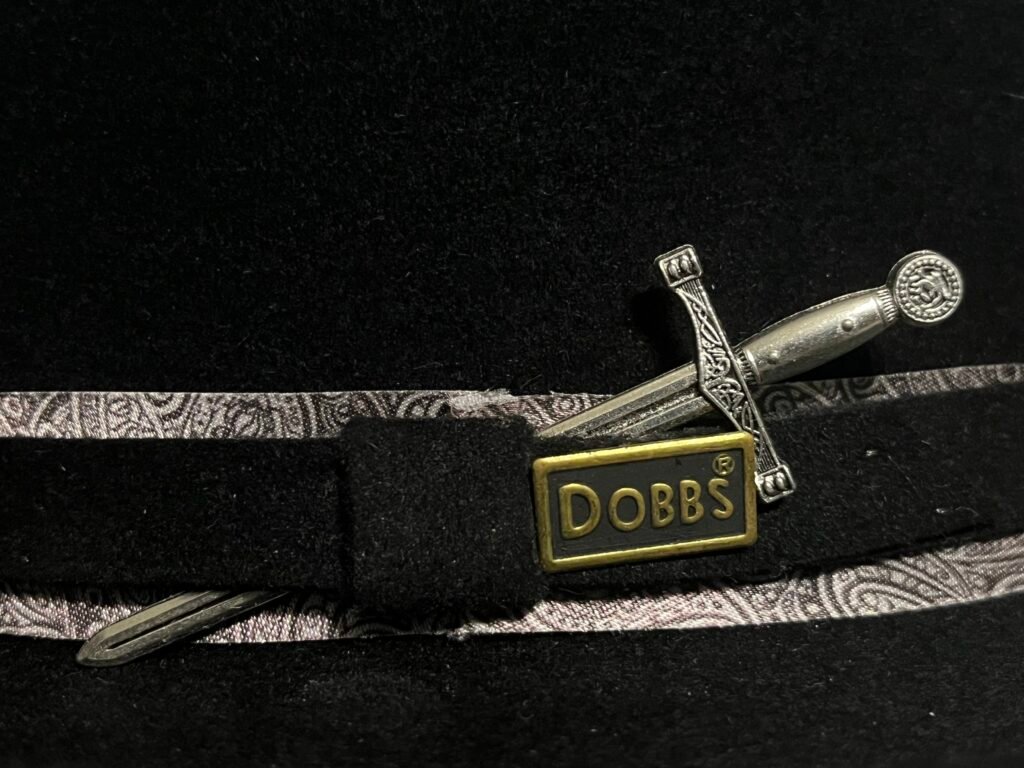 Detail of the Maker’s Sword ornament, original Dobbs ornament, and paisley trim on PM-26-005.