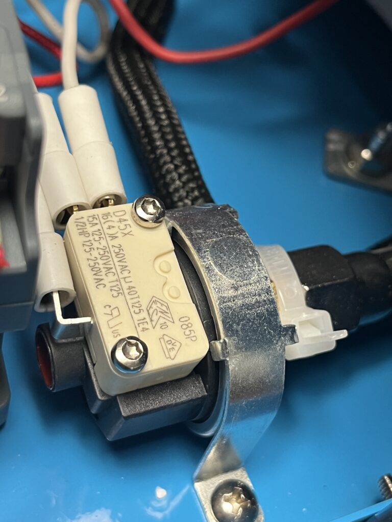ST-750 diaphragm pressure-control assembly showing D45X snap-action microswitch and mechanical pressure-actuation mechanism