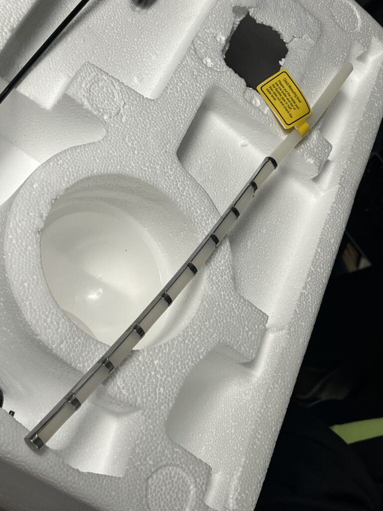 ST-750 water-level dipstick showing metal measuring section with multiple level markings
