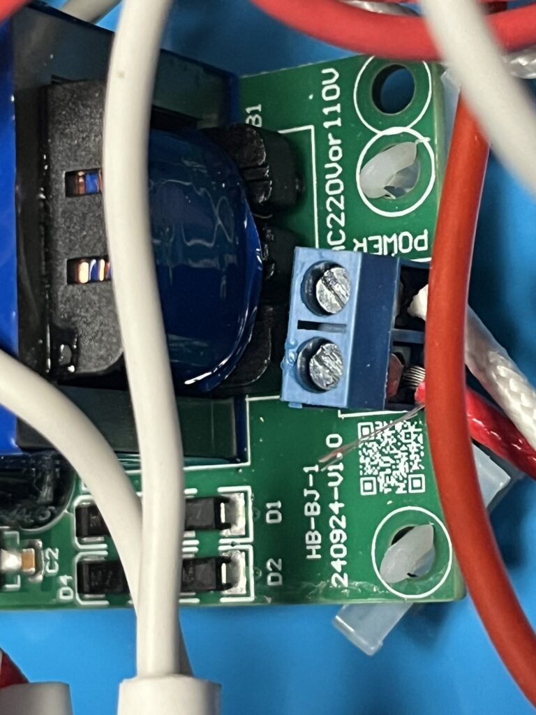 Close-up of ST-750 HB-BJ-1 electronic board showing blue transformer, screw terminal, wiring, and printed HB-BJ-1 and 240924-U10 markings