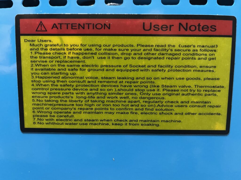 ST-750 Attention User Notes safety warning label mounted on boiler cabinet