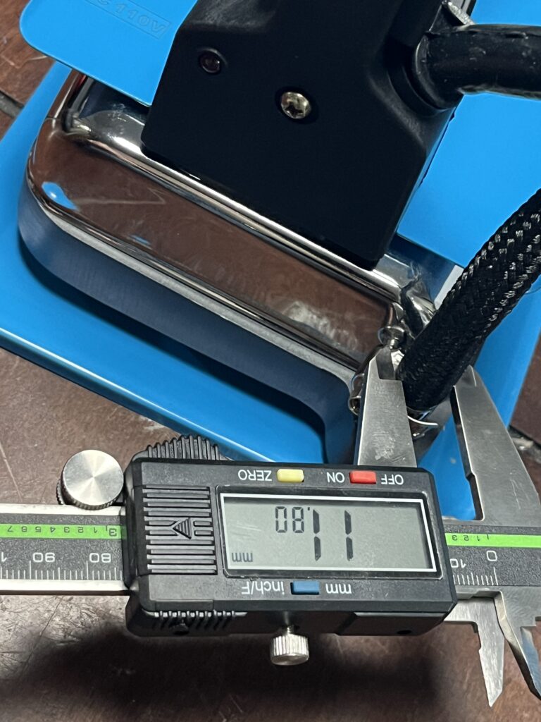 Digital caliper measuring the outside diameter of the ST-750 braided steam hose at 11.80 mm.