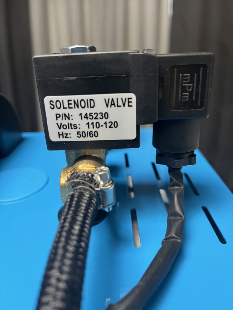 Close-up of ST-750 steam hose connection and P/N 145230 steam solenoid valve