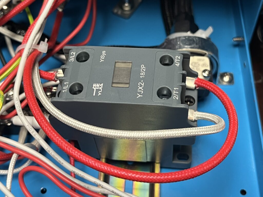 ST-750 YJX2-18/2P two-pole contactor showing YiSys and YIJIA markings, power terminals, and connected wiring