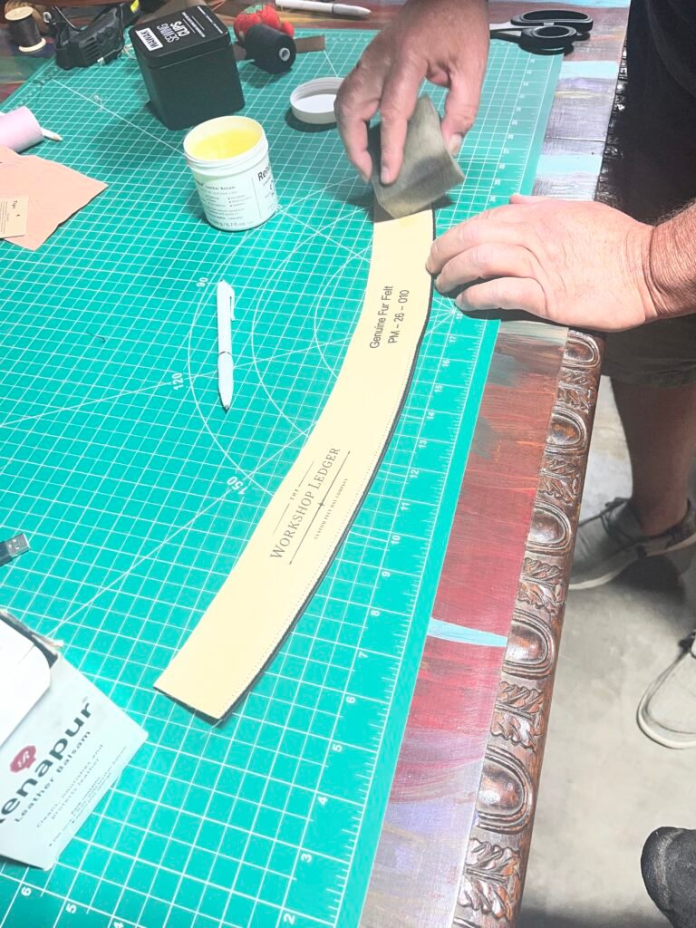 Preparing the leather sweatband for Project PM-26-010 before joining and installation.