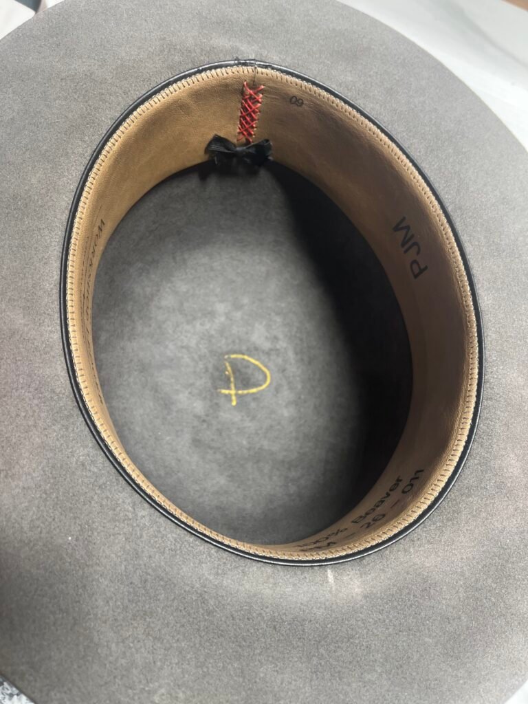Installed leather sweatband inside Project PM-26-011 after hand sewing, showing the completed interior fit.